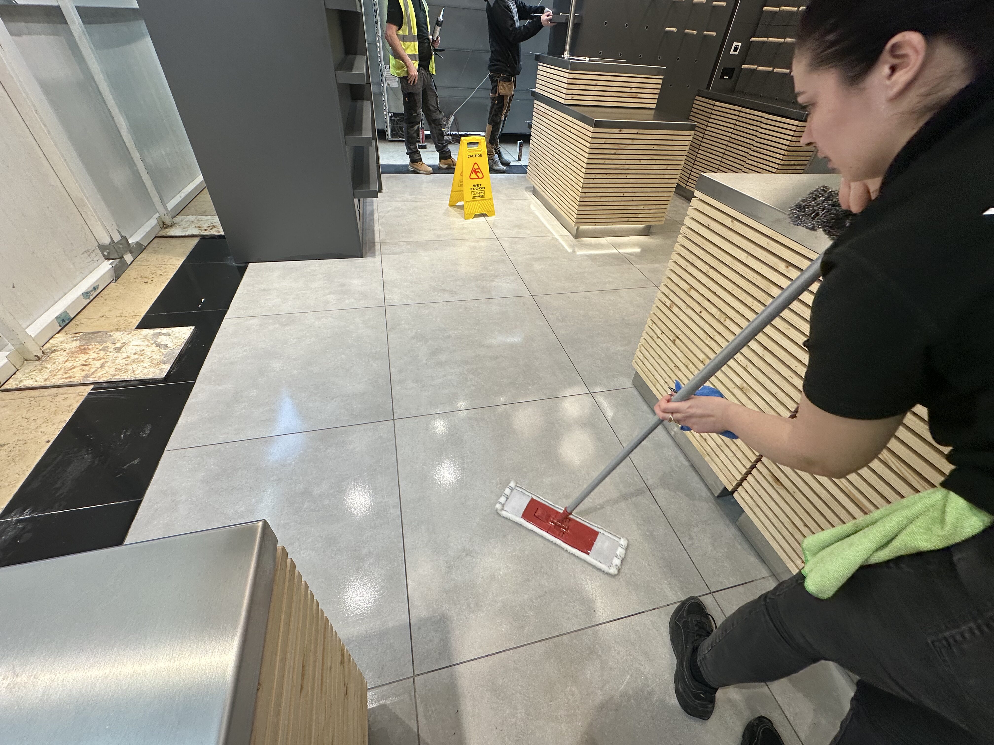 Hexaclean Solutions staff performing post-construction cleaning at Dunnes Stores fitout for Kilrock Construction