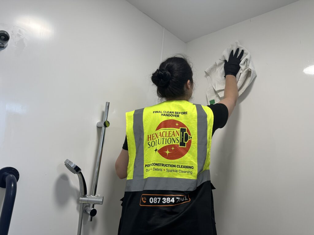 Hexaclean Solutions operative performing restaurant fit out cleaning in Dublin — detail clean of wet room and shower area during post construction handover