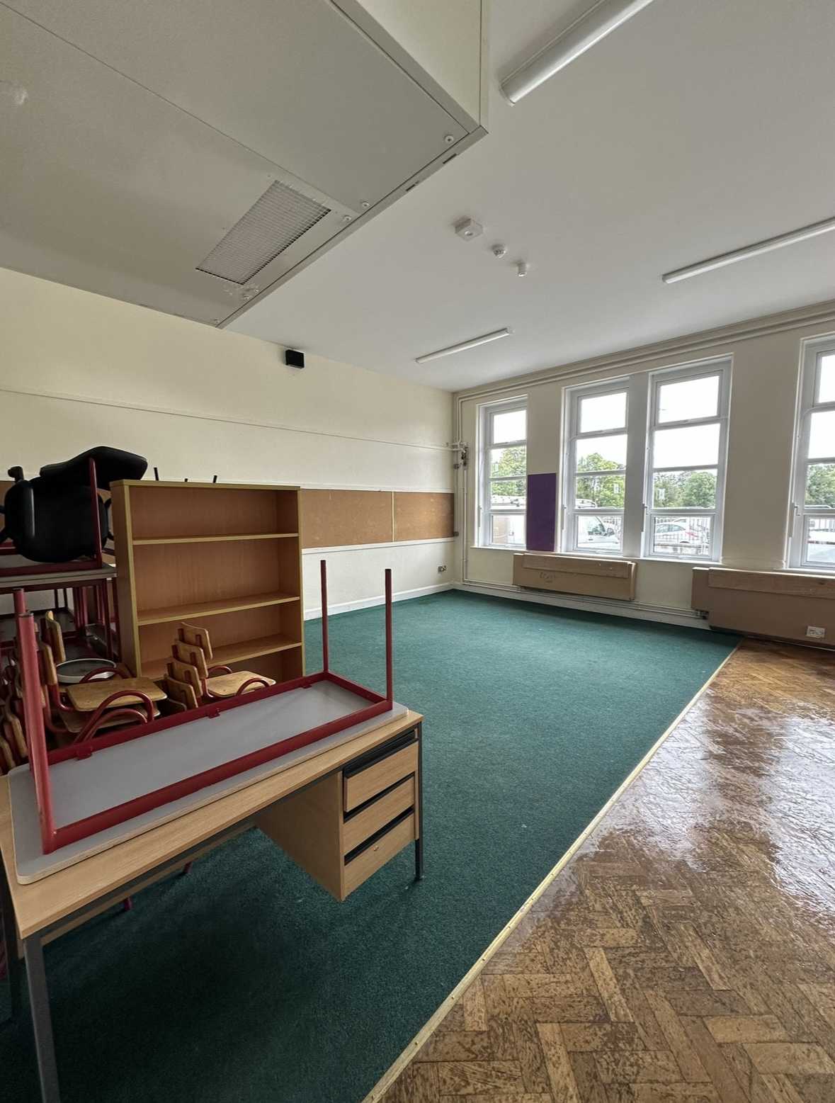Classroom carpet deep cleaned after construction with paint stains removed