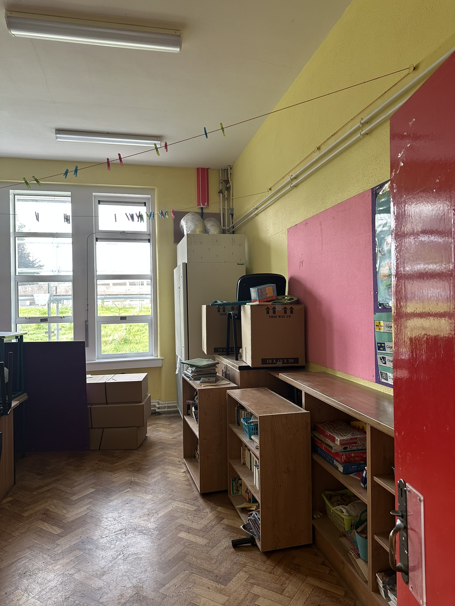 ompleted builders clean classroom after school construction project