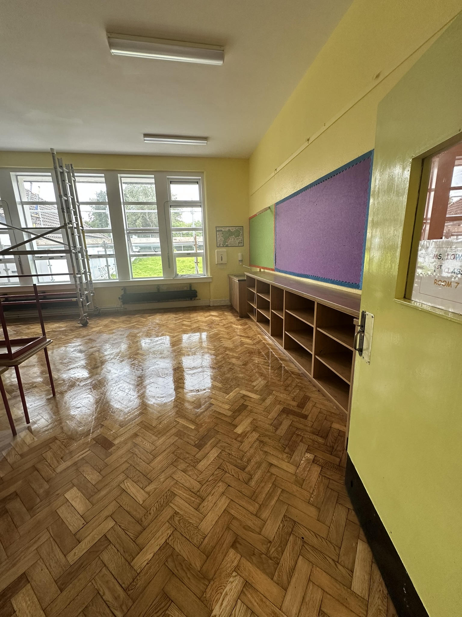 Shining classroom floor after professional buffing post construction
