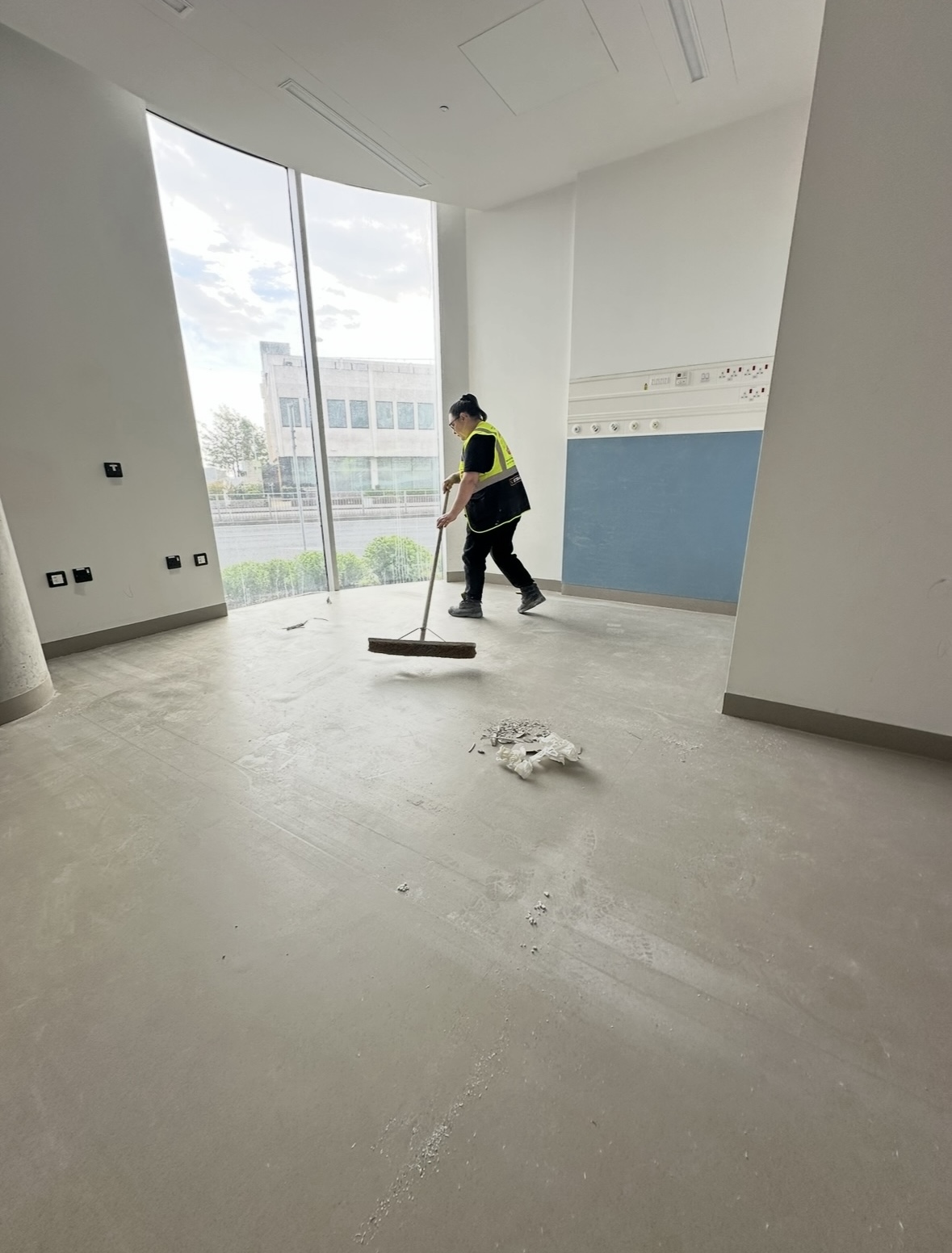 Hexaclean Solutions team member sweeping construction debris at St Vincent's Hospital