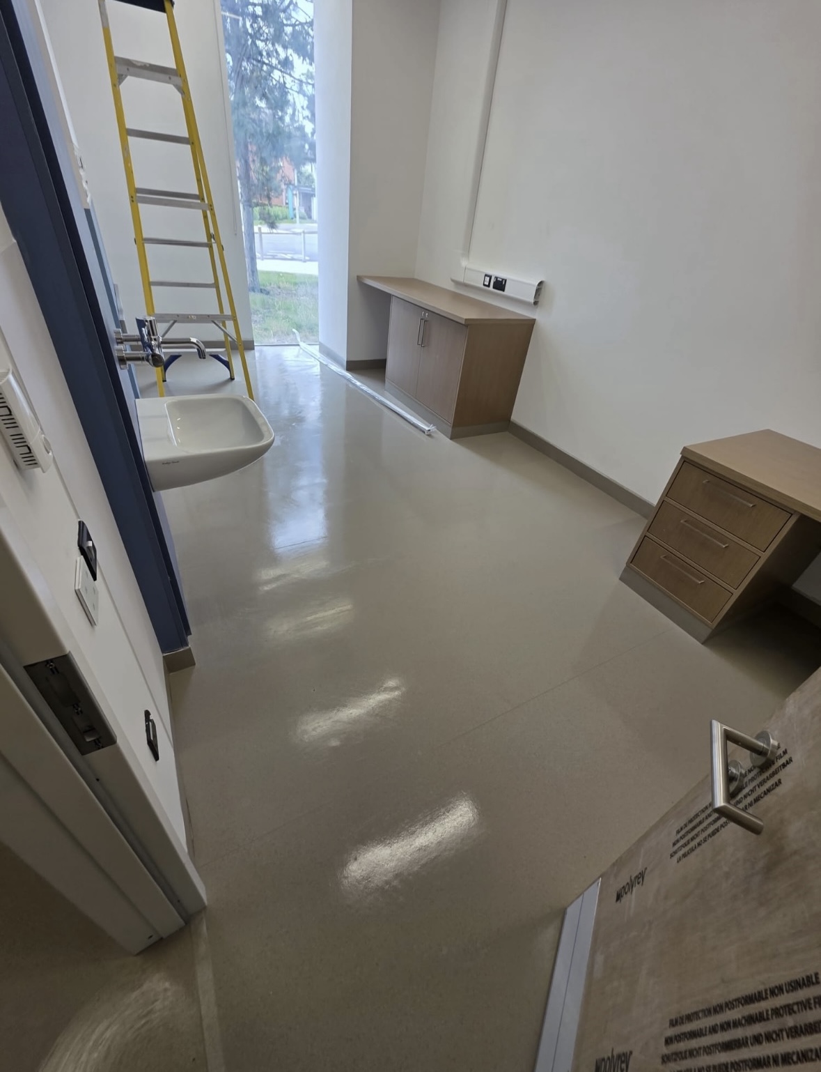 Hospital room with wooden furniture and cleaned floor St Vincent's Hospital