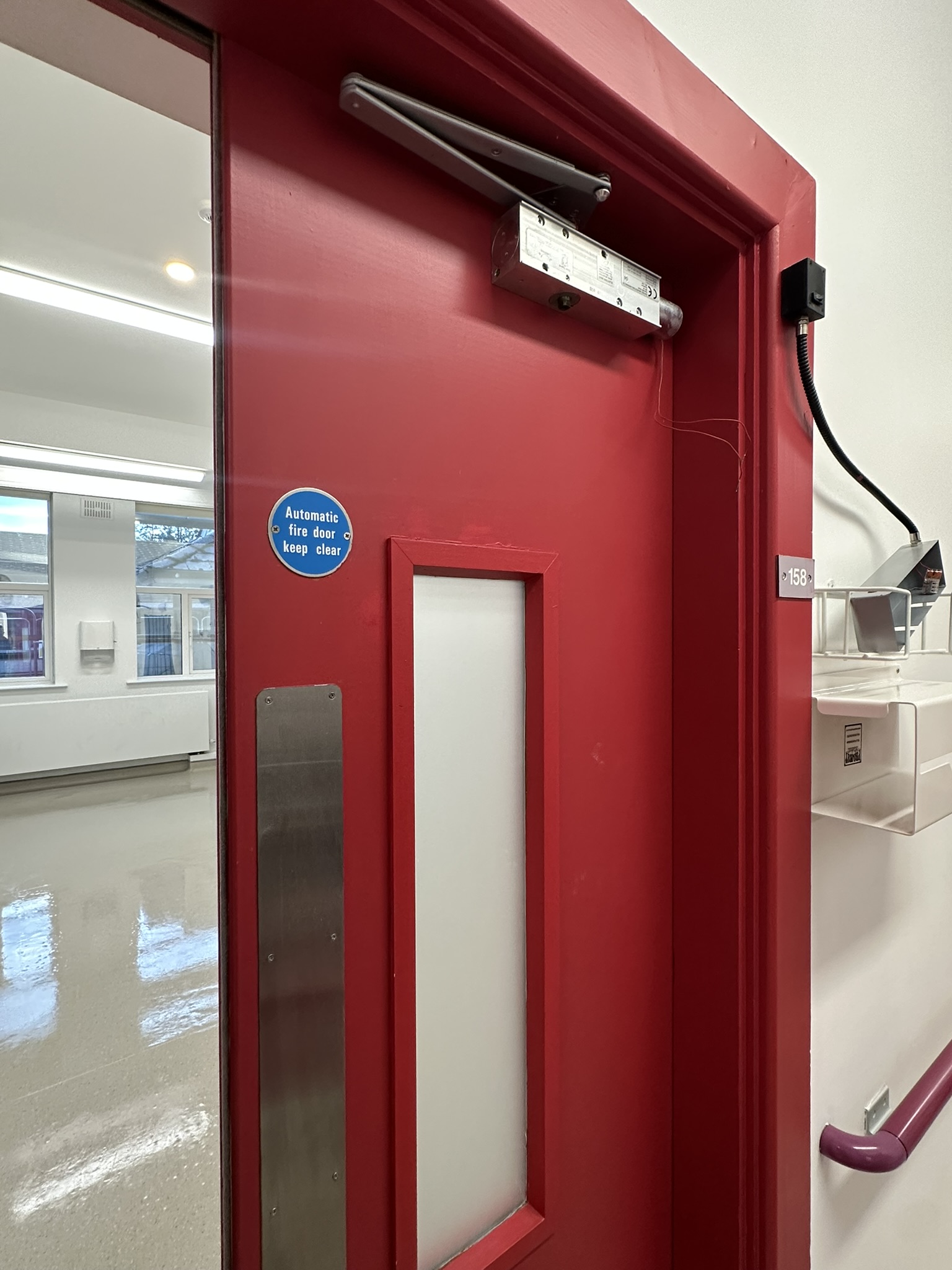 Hospital room door with polished floor visible after post construction clean Baltinglass Community Hospital