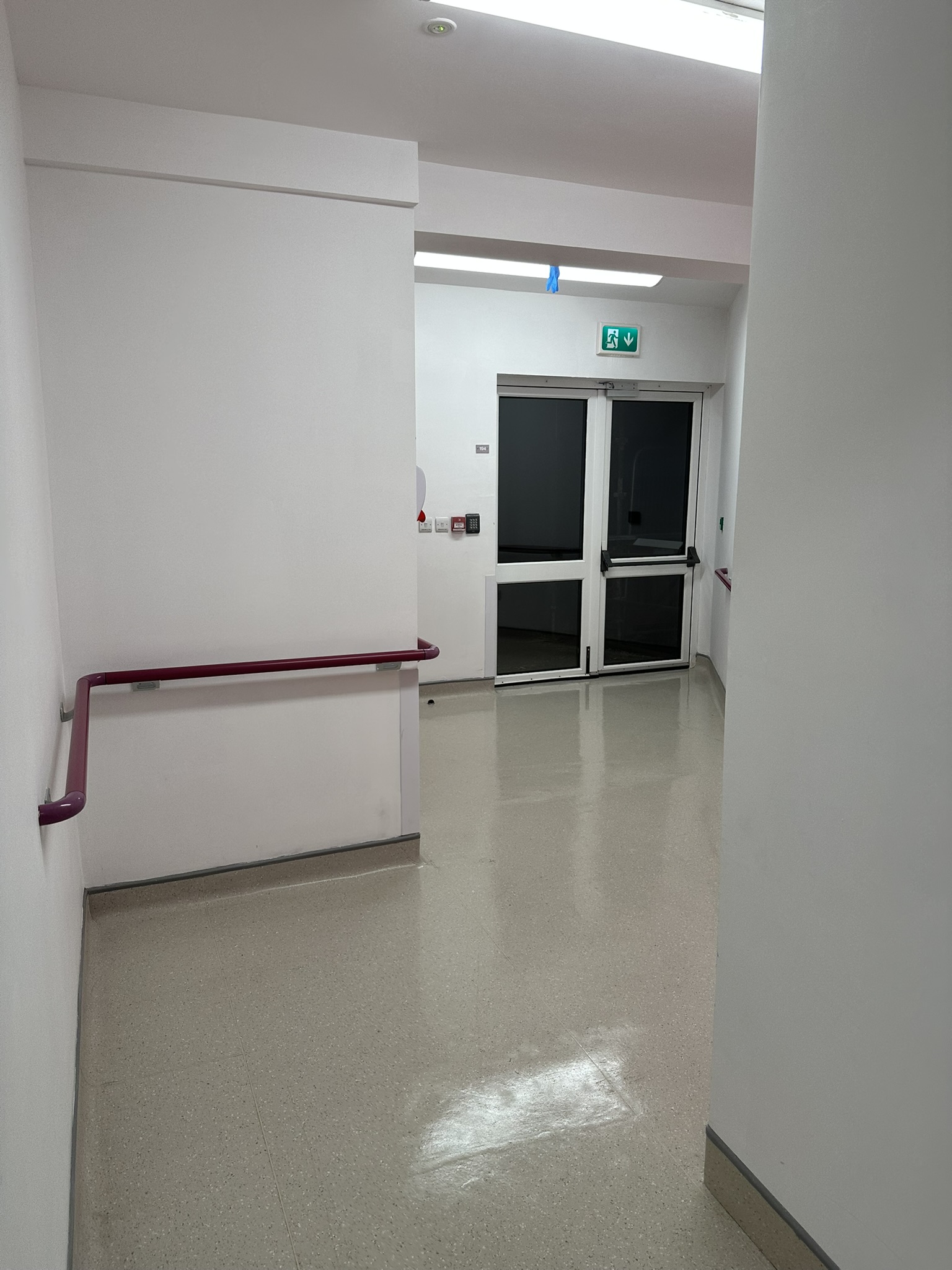 Hospital corridor with polished floor near fire exit doors Baltinglass Community Hospital