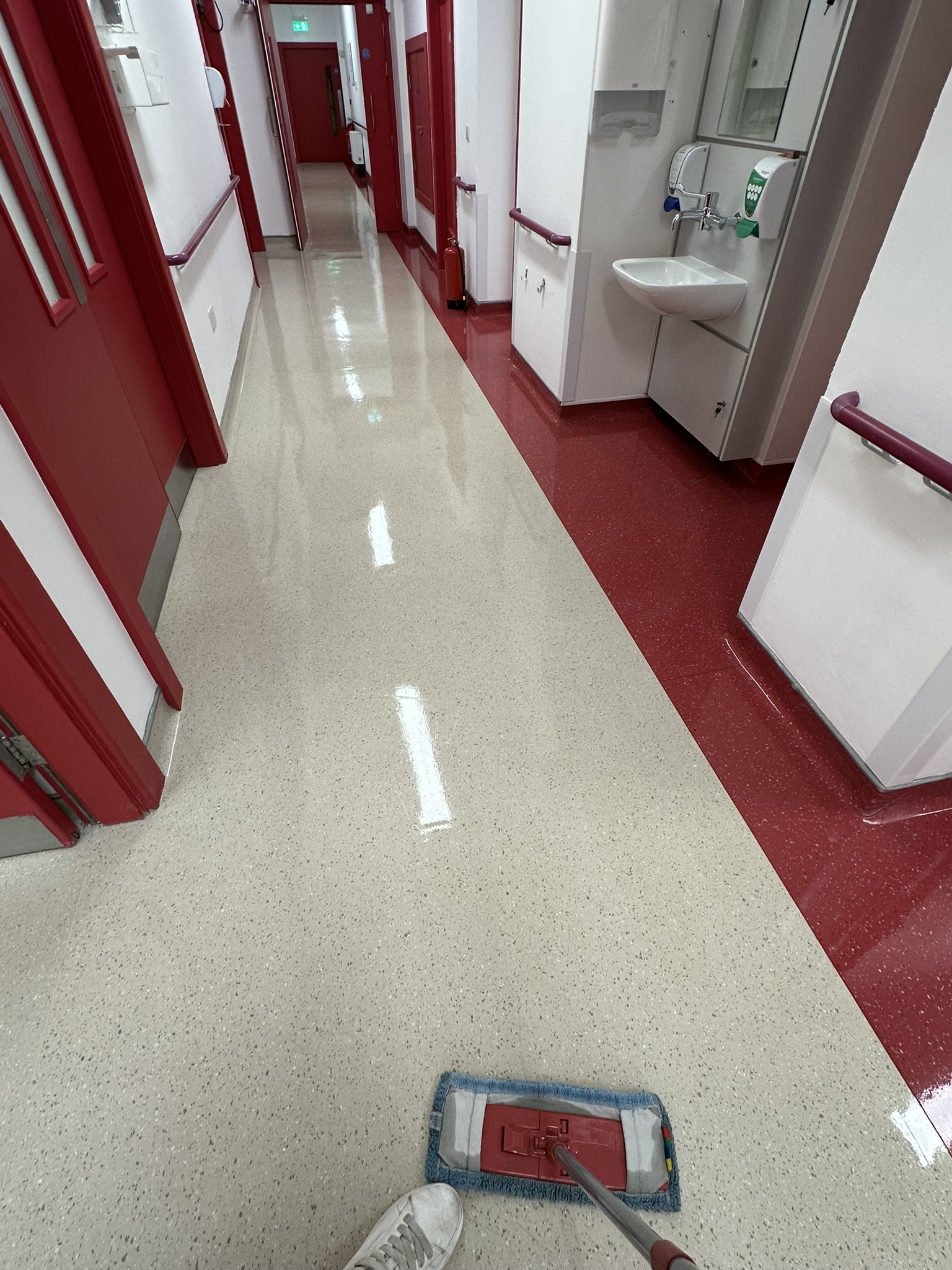 Mopping hospital corridor floor to high shine finish at Baltinglass Community Hospital