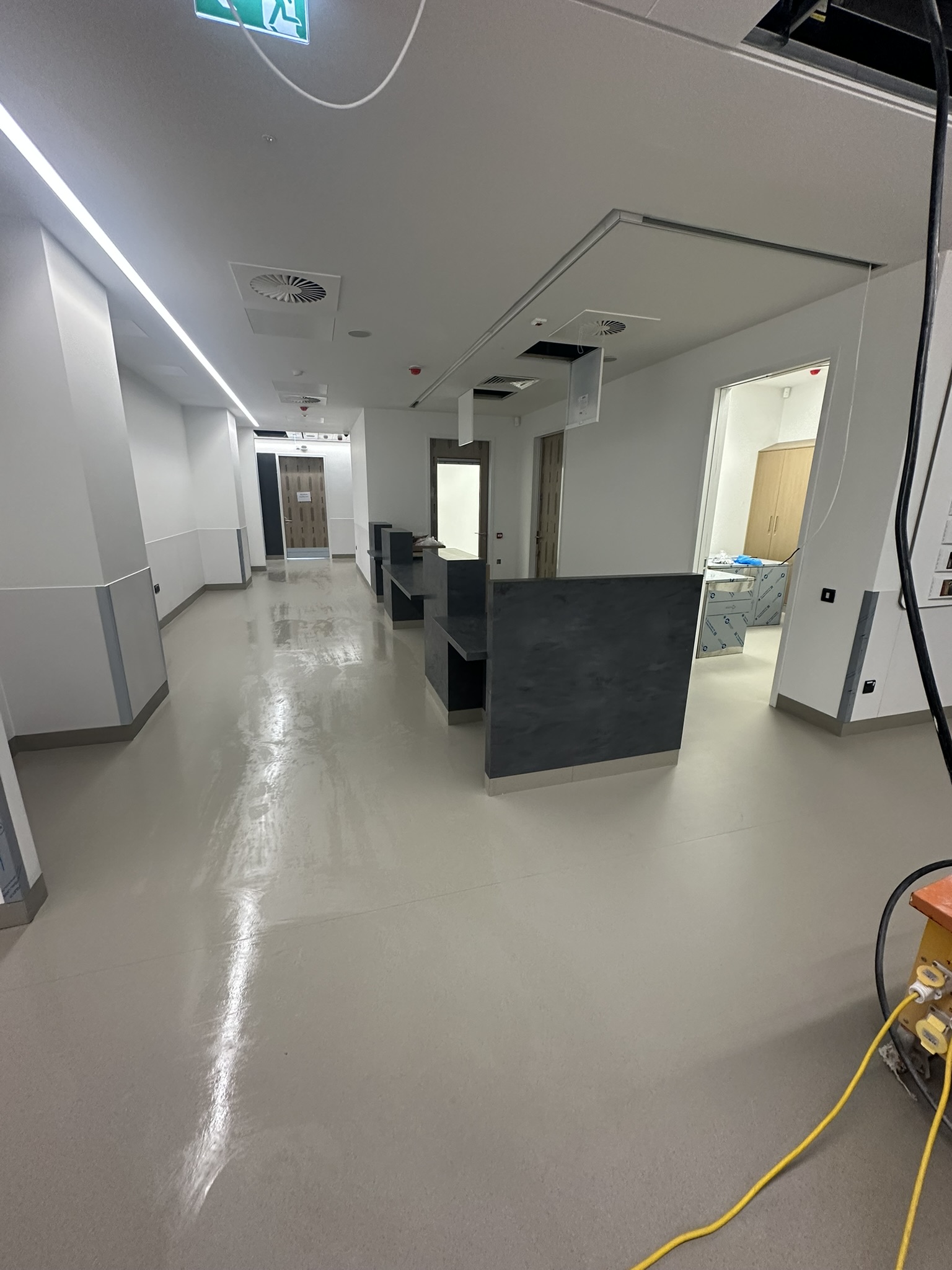 Hospital corridor with reception desks and cleaned floor St Vincent's Hospital