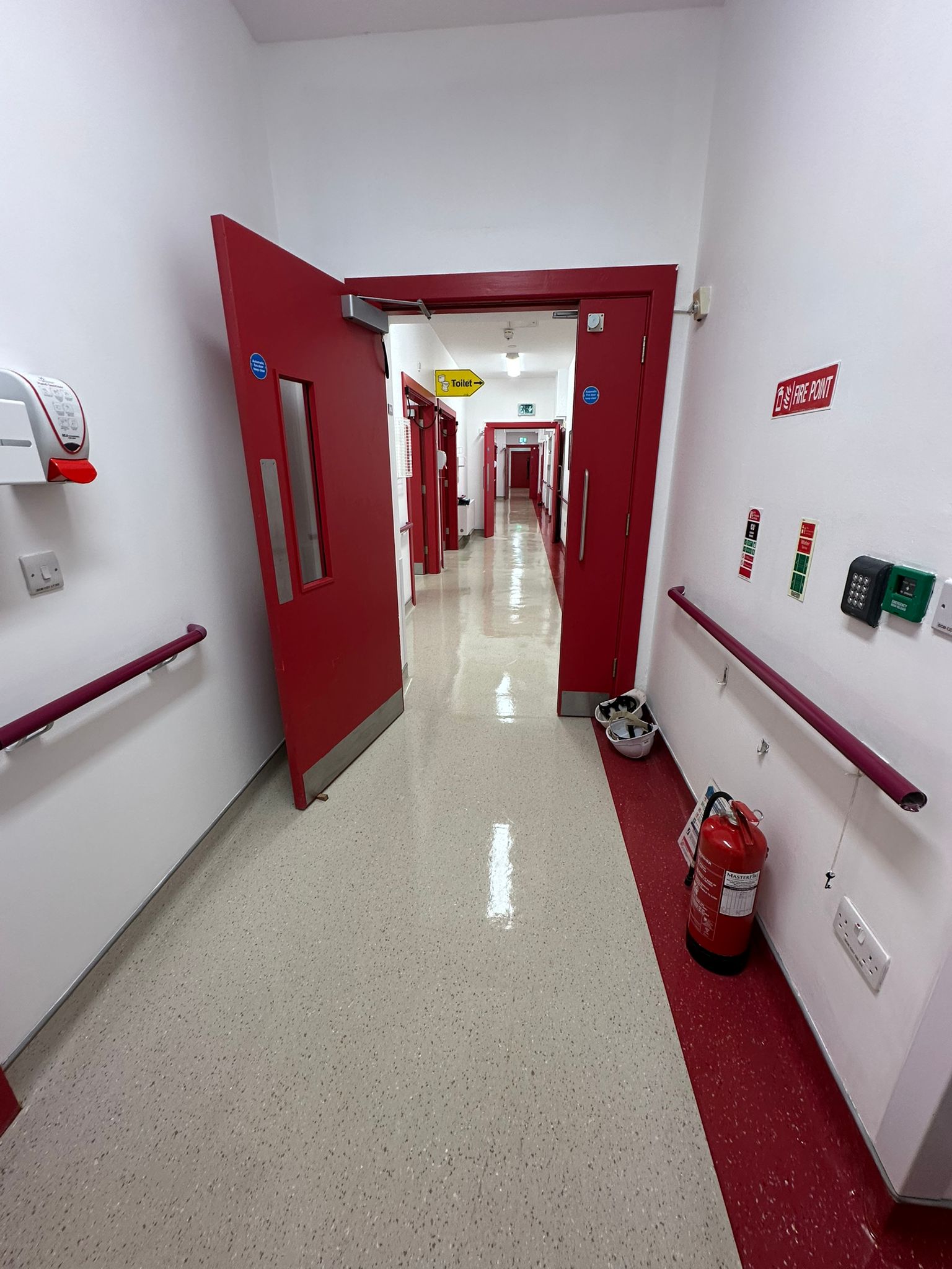 Polished school corridor floor after post construction buffing by Hexaclean Solutions