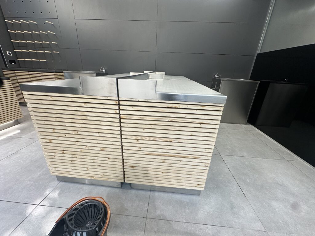 Mopping floor tiles during post construction clean retail store Dunnes Stores