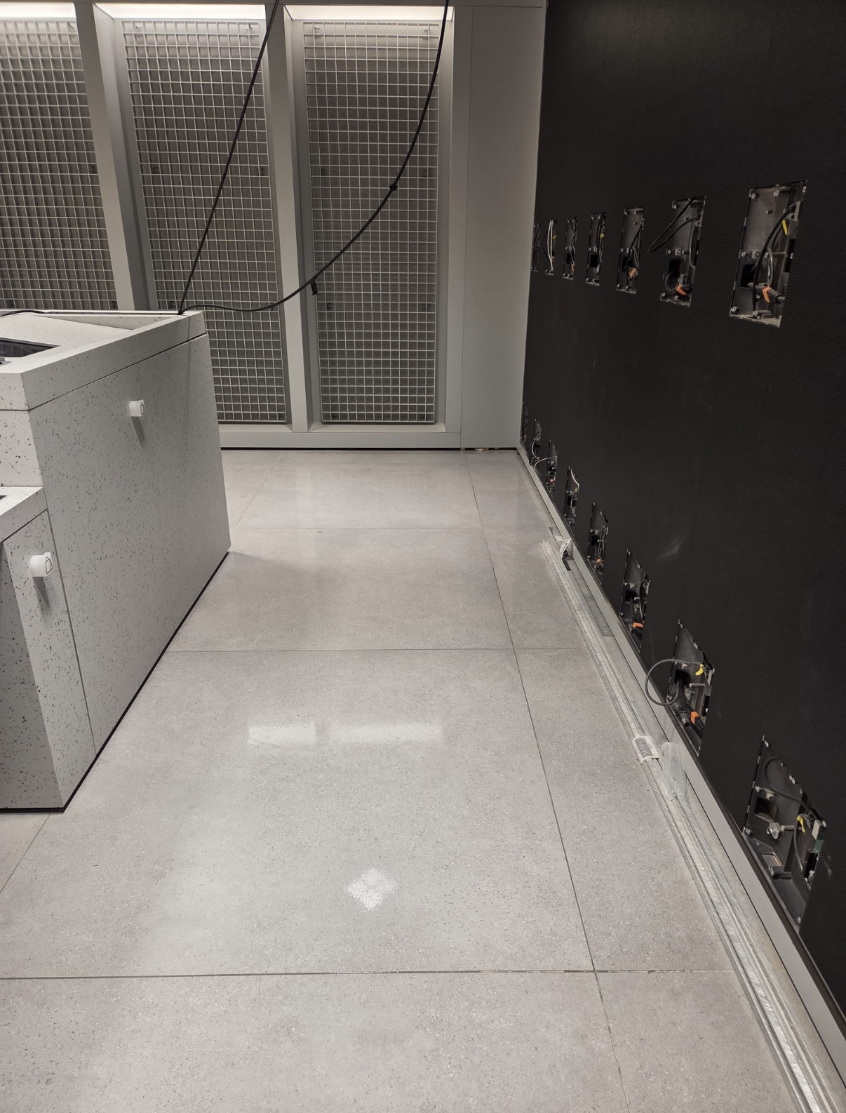 Clean retail fit-out floor in Dundrum, Dublin after post-construction cleaning, with construction dust, footprints and surface residue removed.