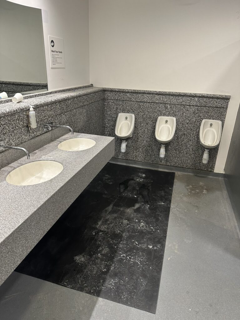 After builders office fit out cleaning in Dublin with construction dust and residue being removed from a commercial washroom.