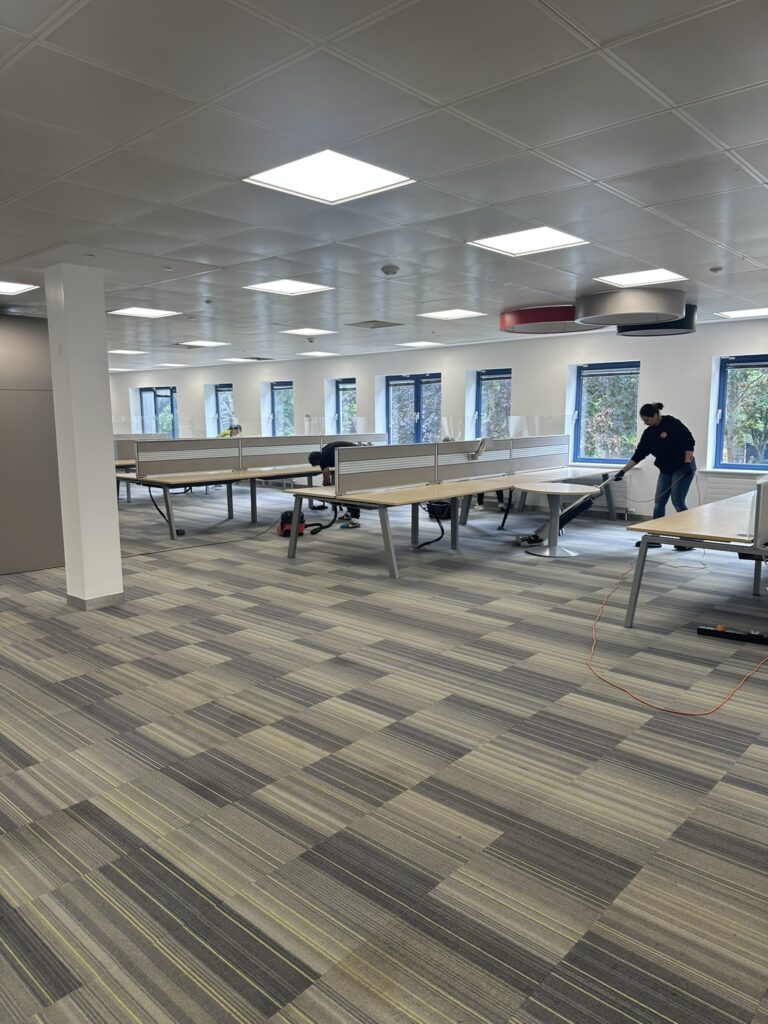 Hexaclean team carrying out after builders office fit out cleaning in a large Dublin office.