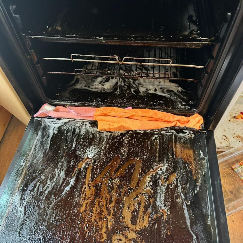 Dirty oven interior with heavy grease and burnt food buildup before professional oven cleaning service in Dublin.