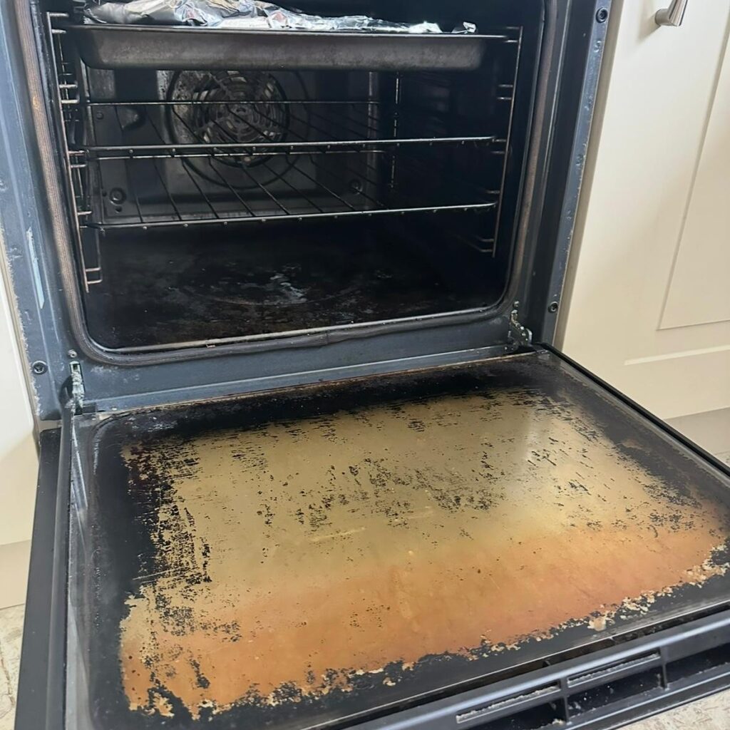 Professional oven deep cleaning process removing grease and burnt food inside an oven in Dublin.