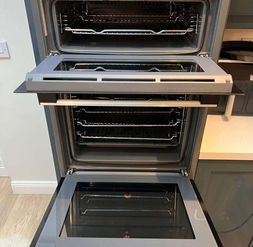 Degreasing the inside of an oven during a professional oven cleaning service in Dublin.